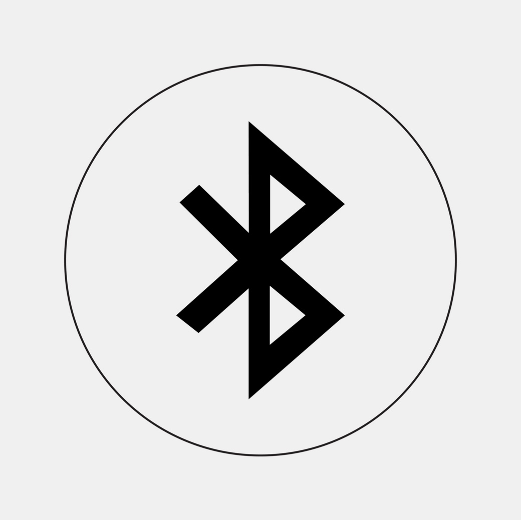  A simple black Bluetooth symbol, consisting of a combination of runic letters, enclosed within a thin black circle on a light gray background.